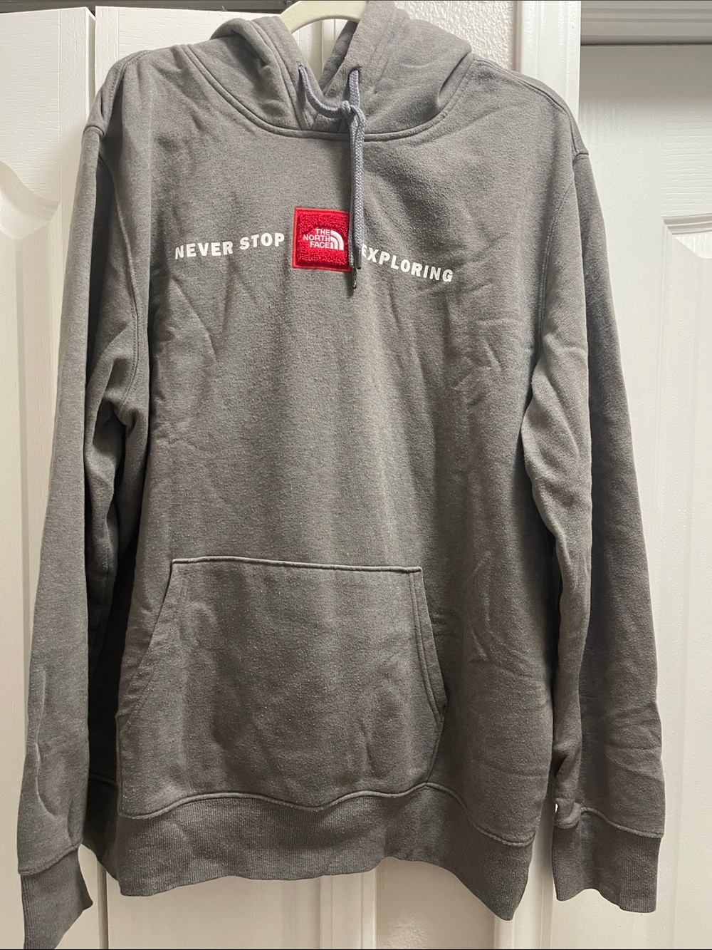 The North Face Gray Hoodie with Red Logo Patch